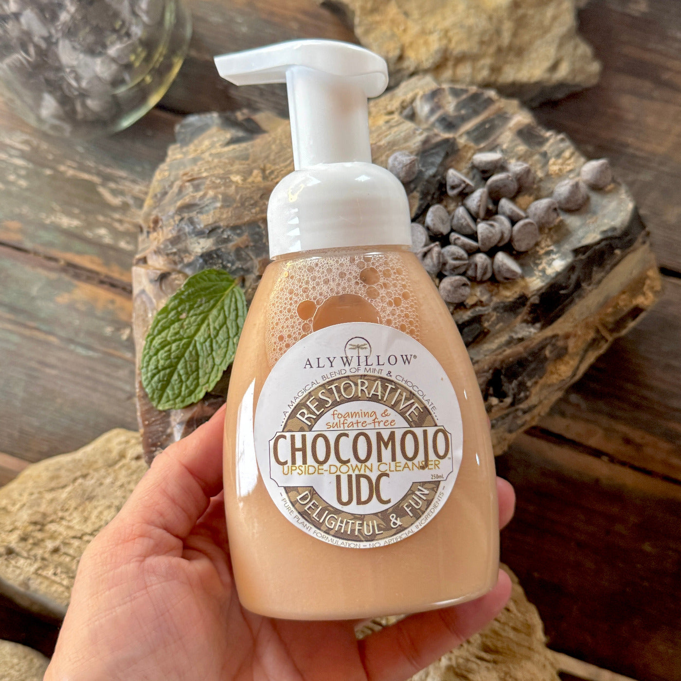 hand holding Chocomojo UDC Cleanser