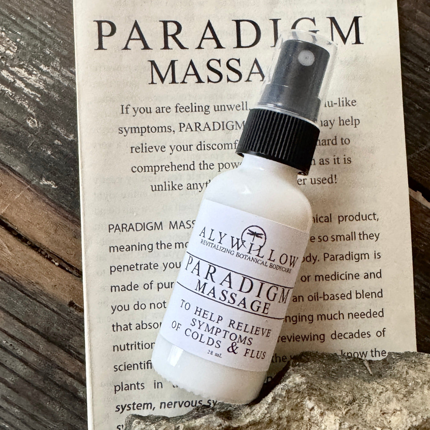 Paradigm bottle and flyer on a table