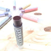 The magical shading of ALCHEMY LIPSTICK is bold and powerful. We add a beautiful  combination of minerals to our unique organic lip balm recipe (using six moisturizing plants) that creates a dark wine color for a dramatic effect. This shade is beautiful on every skin tone and definitely our best seller! Natural, handmade, and vegetarian. There are no bugs, no synthetic ingredients, and no paraffin wax. 